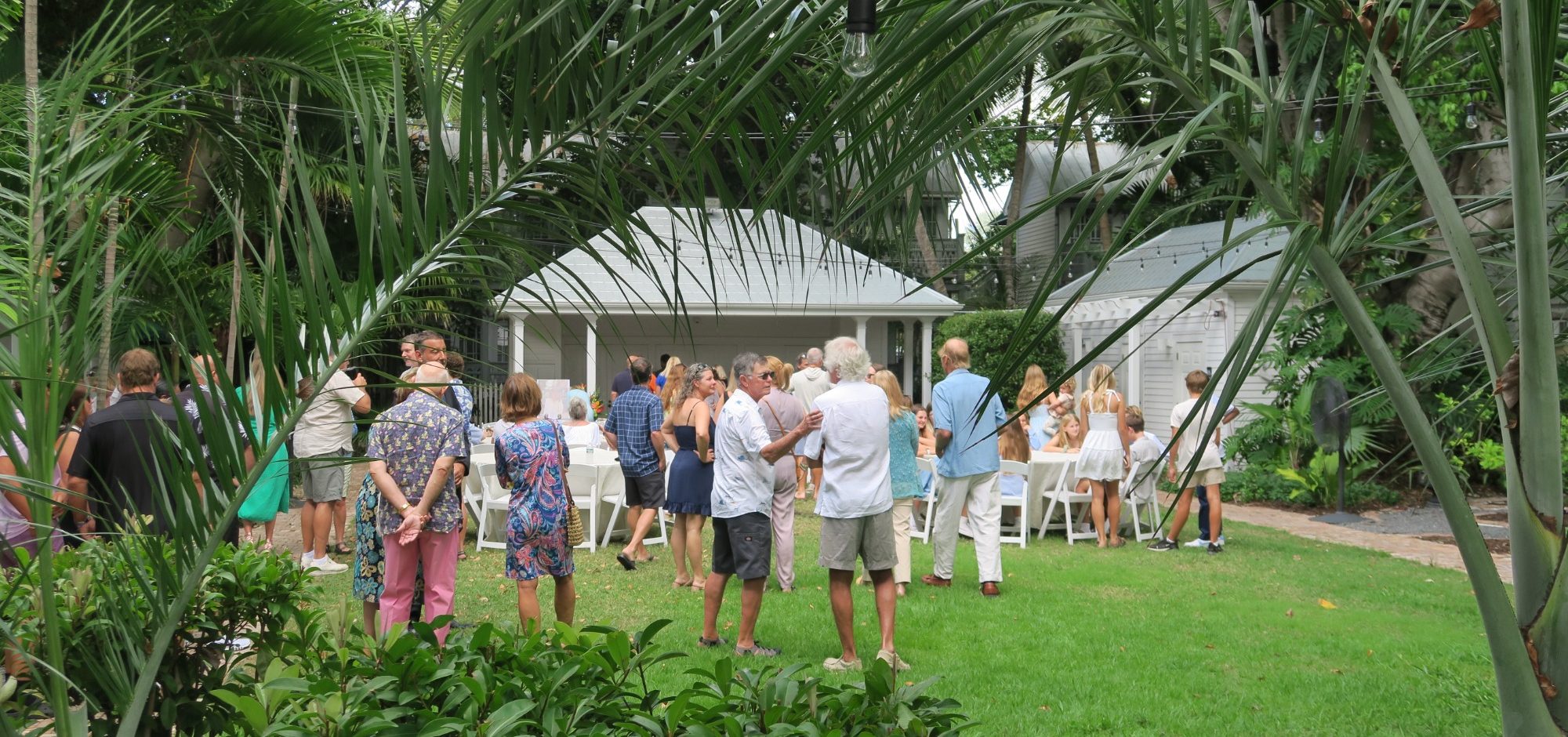 A group of Key West locals gathered on the lawn of the Oldest House, Duval Street Key West for a special occasion 