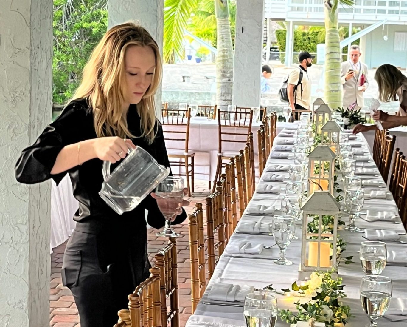 Key West Dockside wedding, DJ and photographer doing walk through while servers top off water glasses before guests arrive    