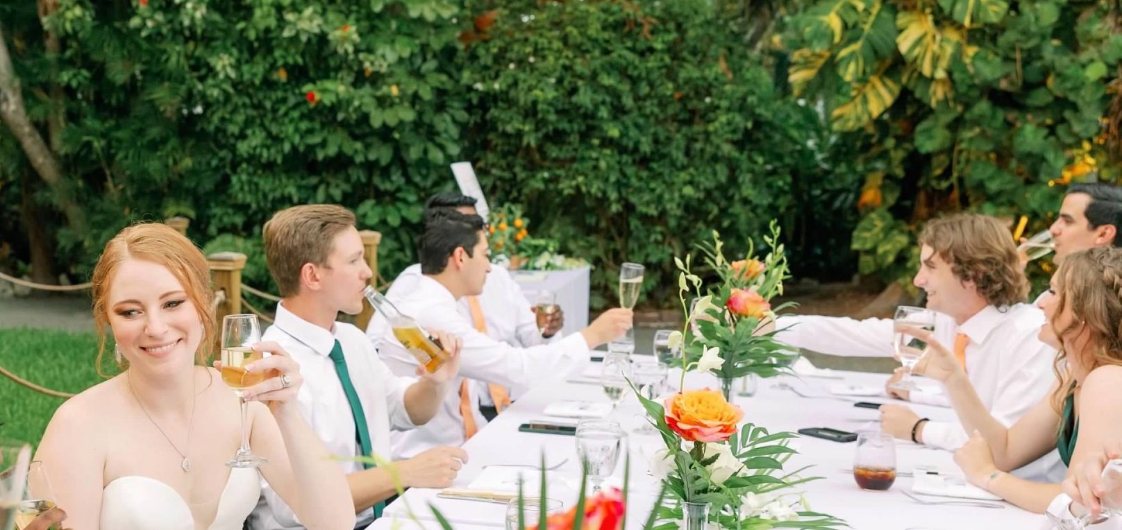 Group of Key West Wedding guests toasting the happy couple, Hemingway House.